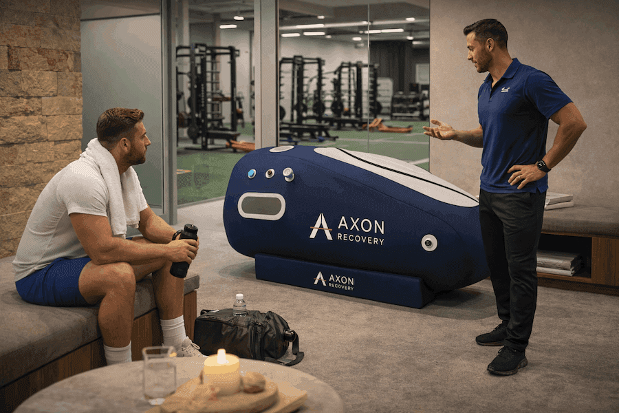 Athletes reviewing a Vertex hyperbaric chamber in a recovery environment